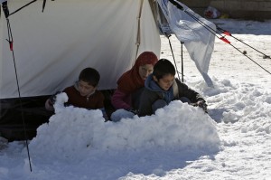 Syrian refugee children play in the snow which turned deadly. during Christmas, 2013 seven children froze to death in just one UN refugee camp.