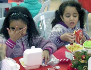 Christian girls enjoy a Christmas meal rather than slavery under radical Islam