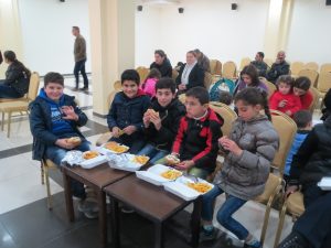 Children in Jordan enjoying their meals.