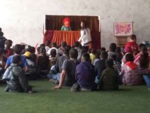 Children watch puppet show explaining the true meaning of Christmas - the coming of Jesus Christ
